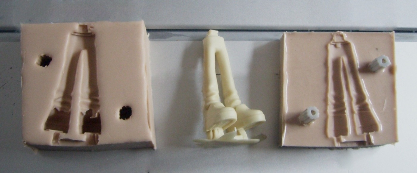 Two-part silicone mold and resin cast part for vacuum casting